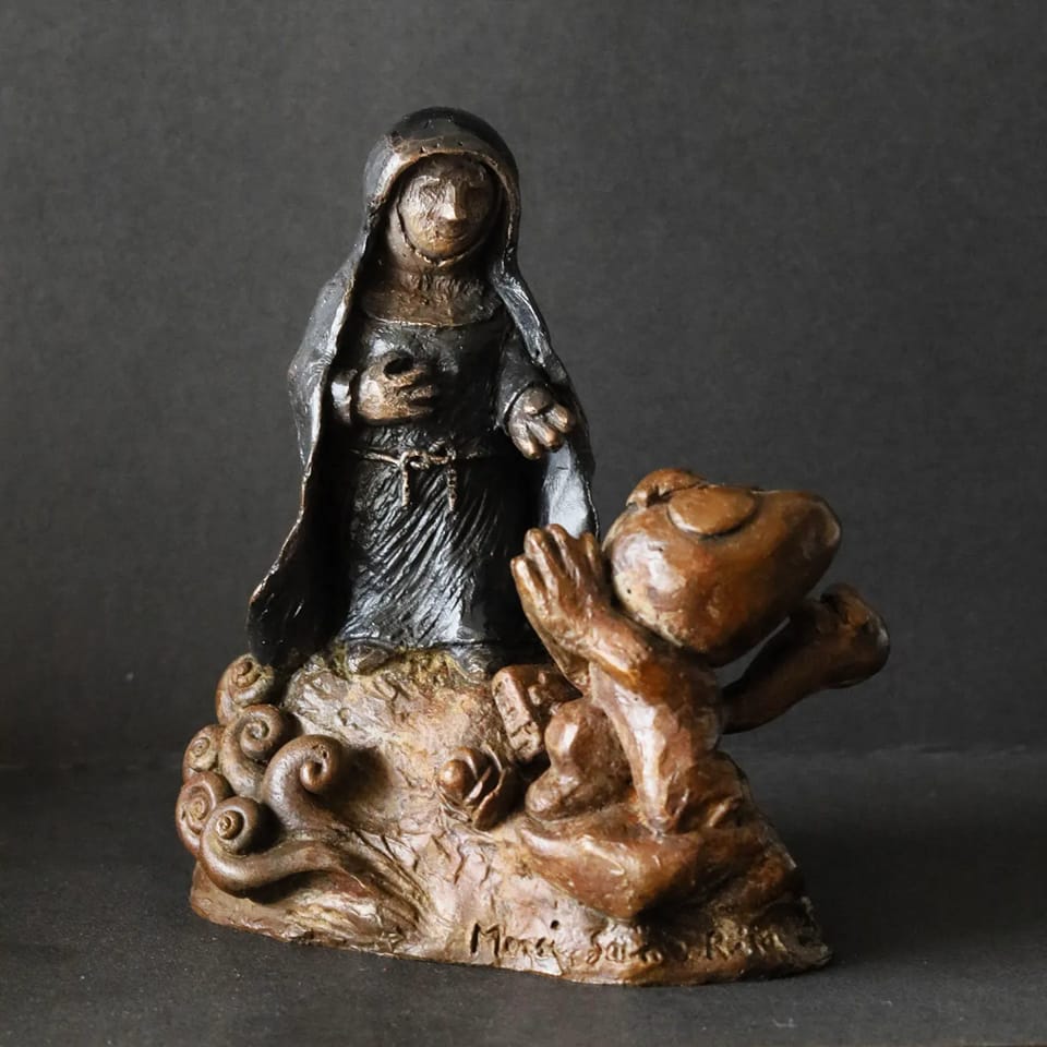 Une sculpture en bronze de Sainte Rita, en forme d'ex voto.